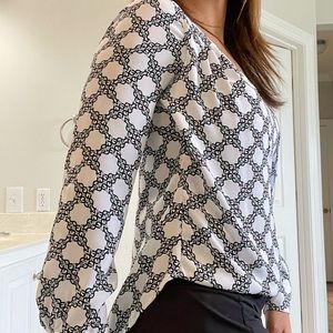 White House Black Market blouse , looks great with black pants and blue jeans.